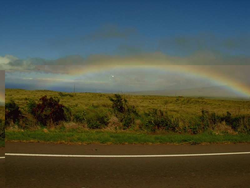 photo of rainbow over south side of Big Island, Hawaii